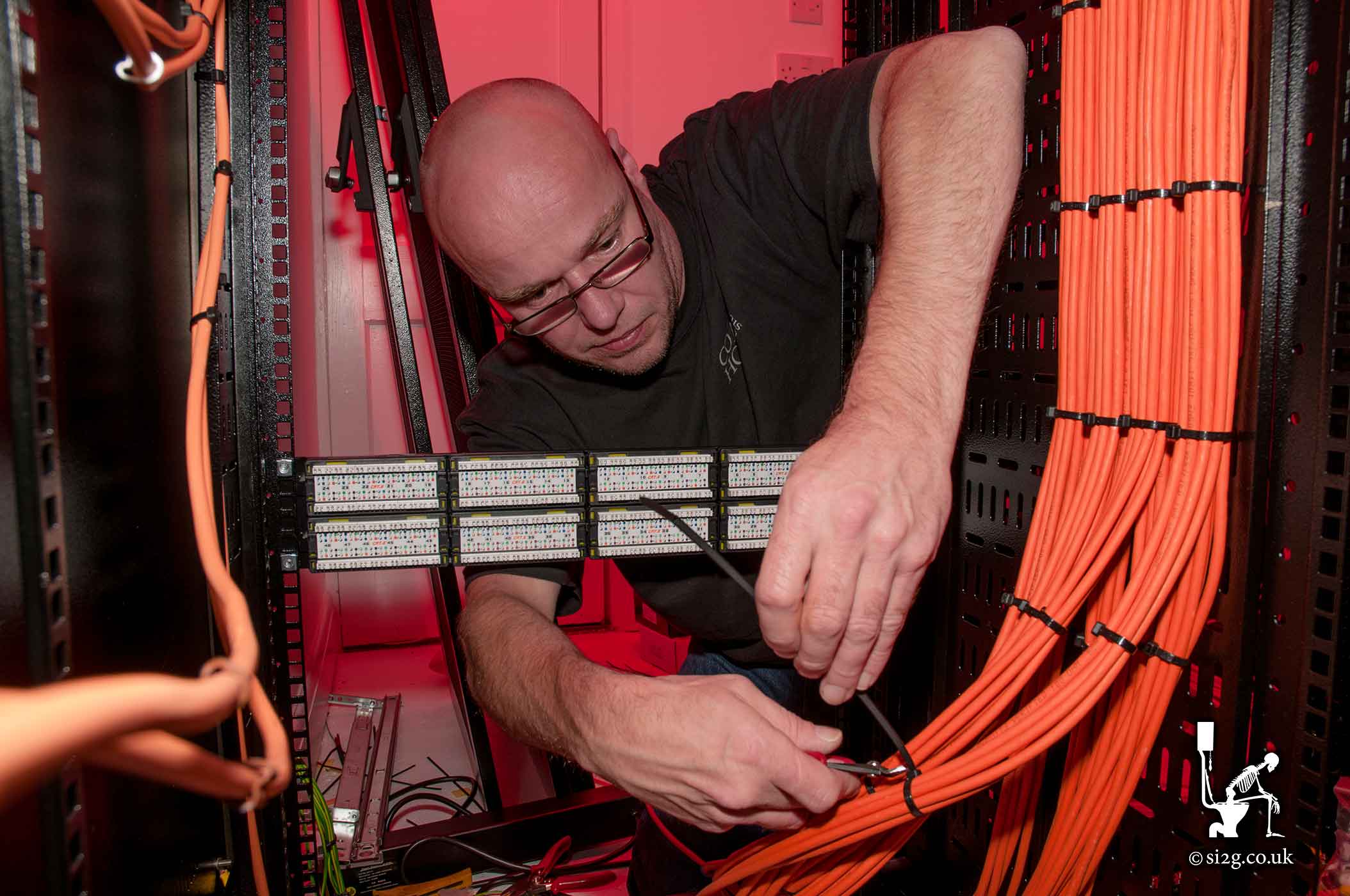 Structured Cabling - Our engineer, Grant, seen here wiring CAT6 network cables up to the edit suites.