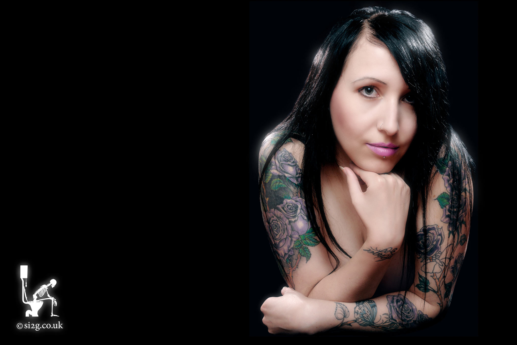 Alternative Model with Tattoos - A tasteful image of an alternative model showing off her tattoos.