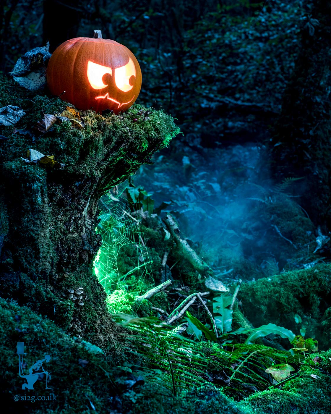 Seasonal Branding - Halloween - We revisited the Halloween Pumpkin Jackolantern in the forest idea.  Choosing to shoot in daylight this time we found we were able to achieve a spooky evening look much more easily.  Spray mist and remote-controlled speedlights with coloured gels added that cartoon factor we were hoping to achieve.  Needless to say, the client was extremely happy with the results and ran a successful campaign with their company branding.