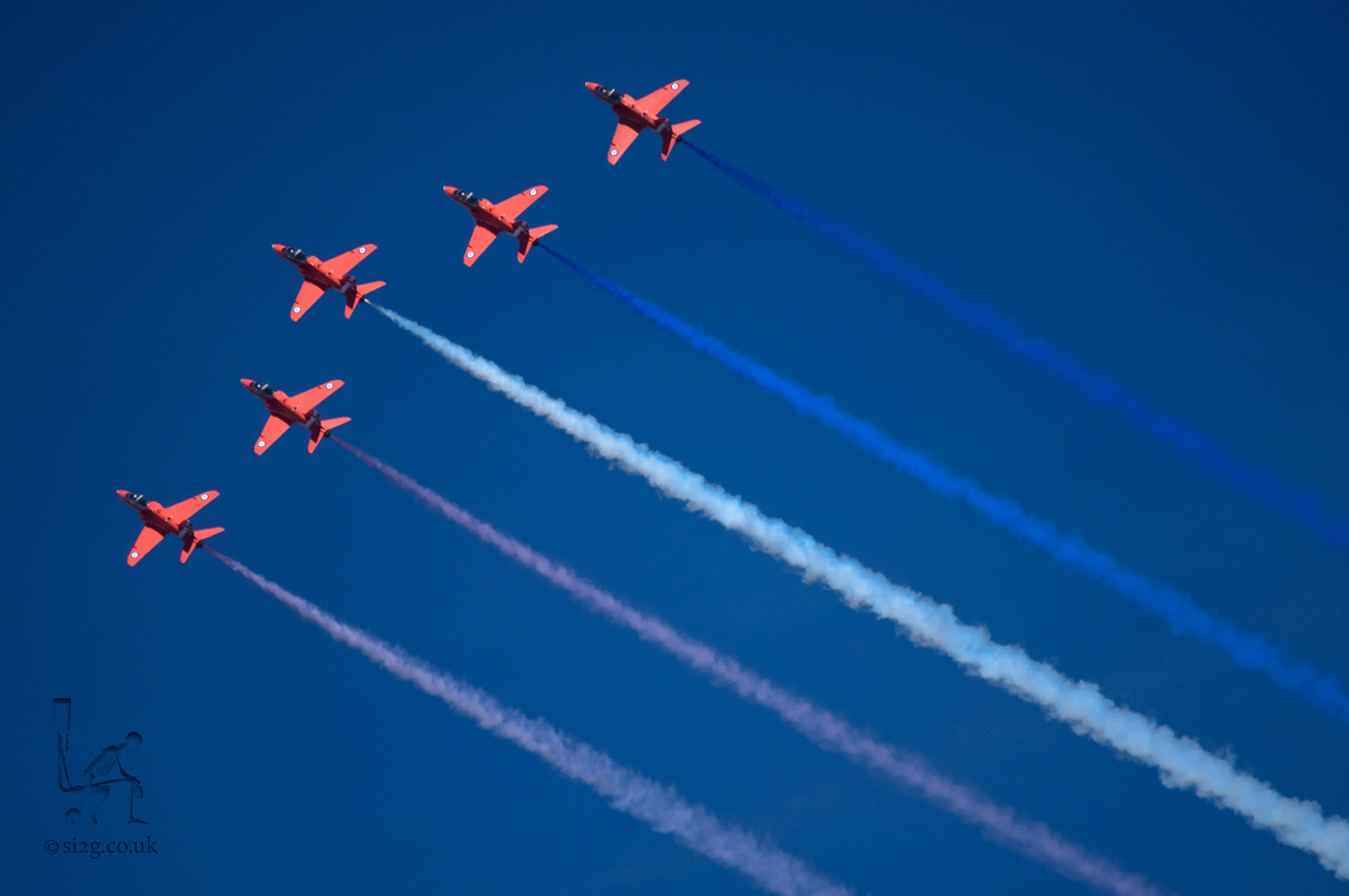 Wales National Air Show - The Red Arrows always seam to steal the show, with their trails of coloured smoke and daredevil manoeuvres.  On this particular day the weather was clear and the sky was blue, allowing for crisp shots like this one.