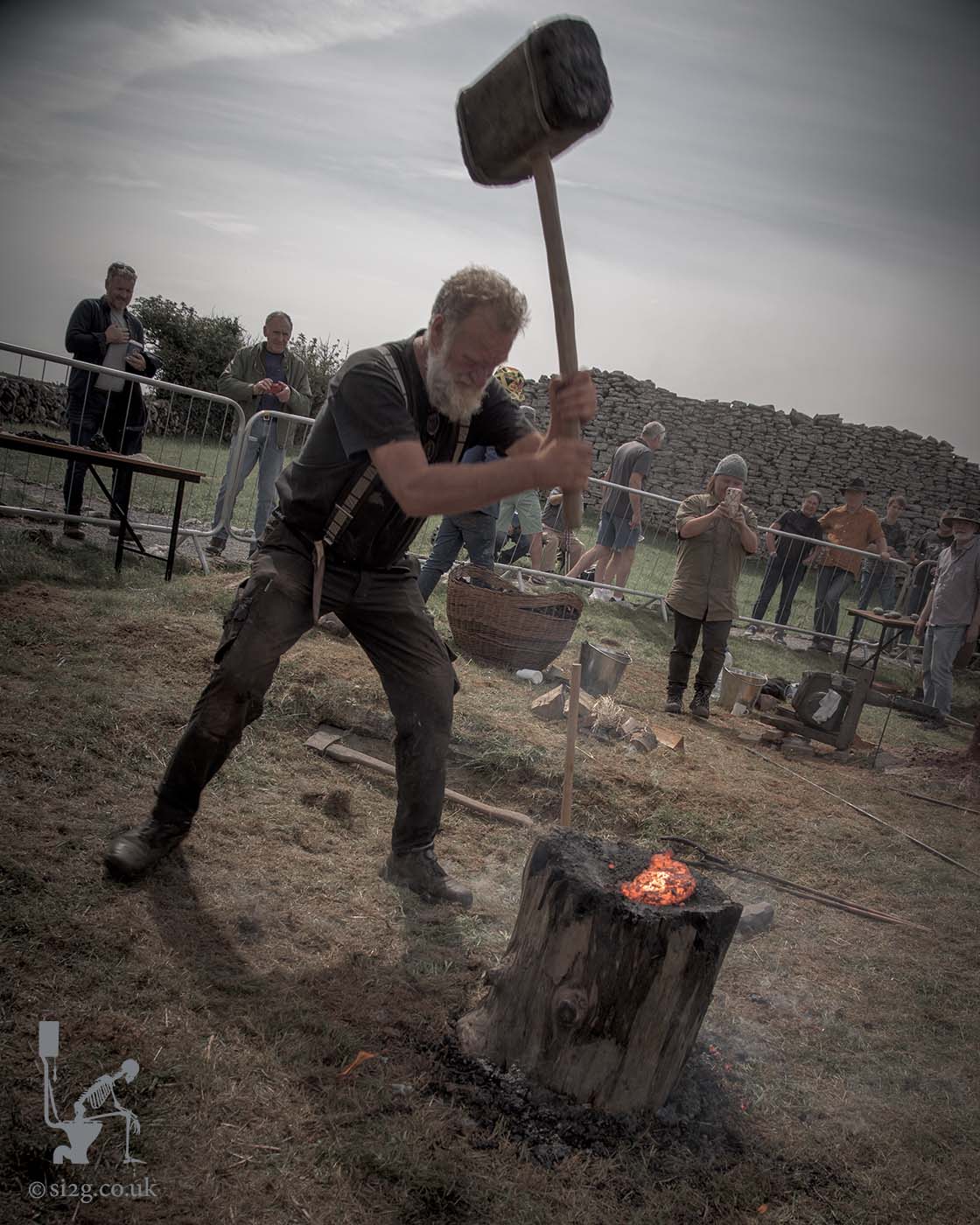 Iron Smelting Festival 02 - Giving the iron bloom a good wallop.